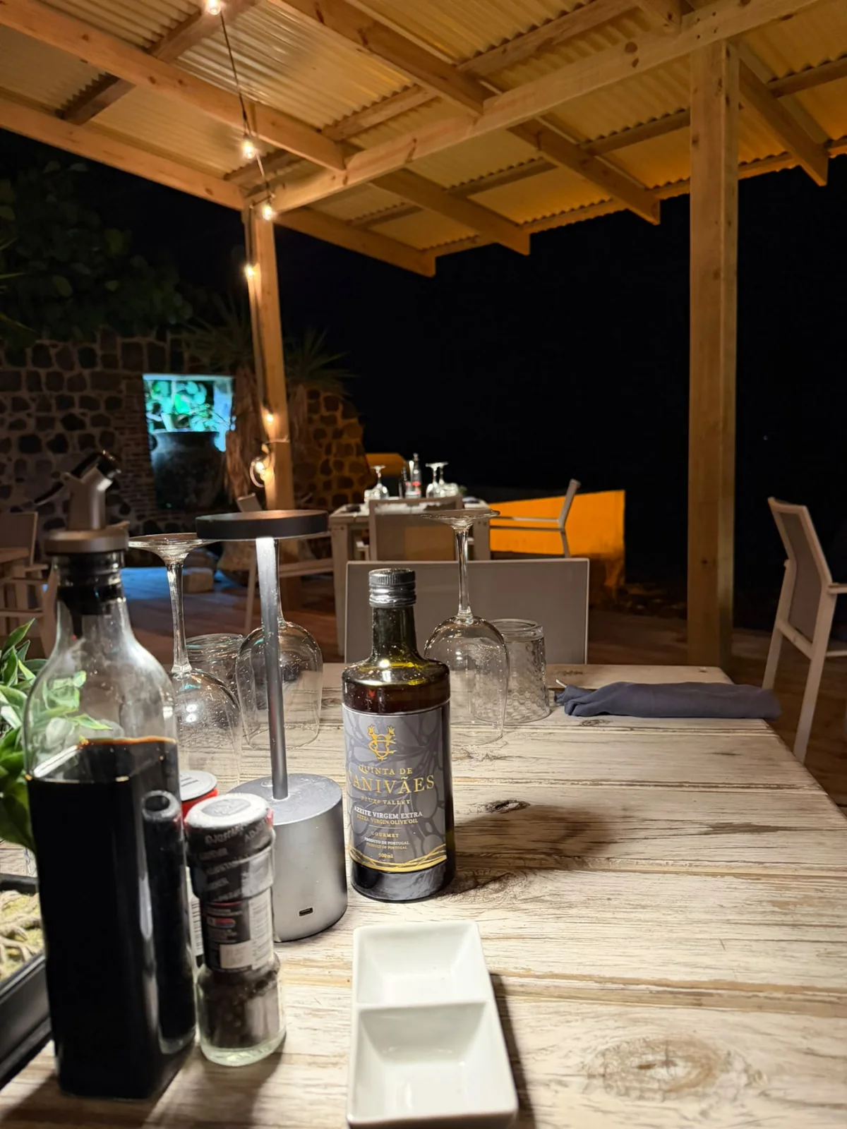 A dining table prepared for evening service on the Barrel House terrace