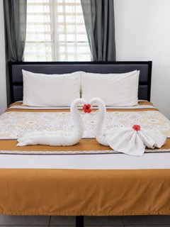 A double room prepared for guests at Cattleya Flor Hotel